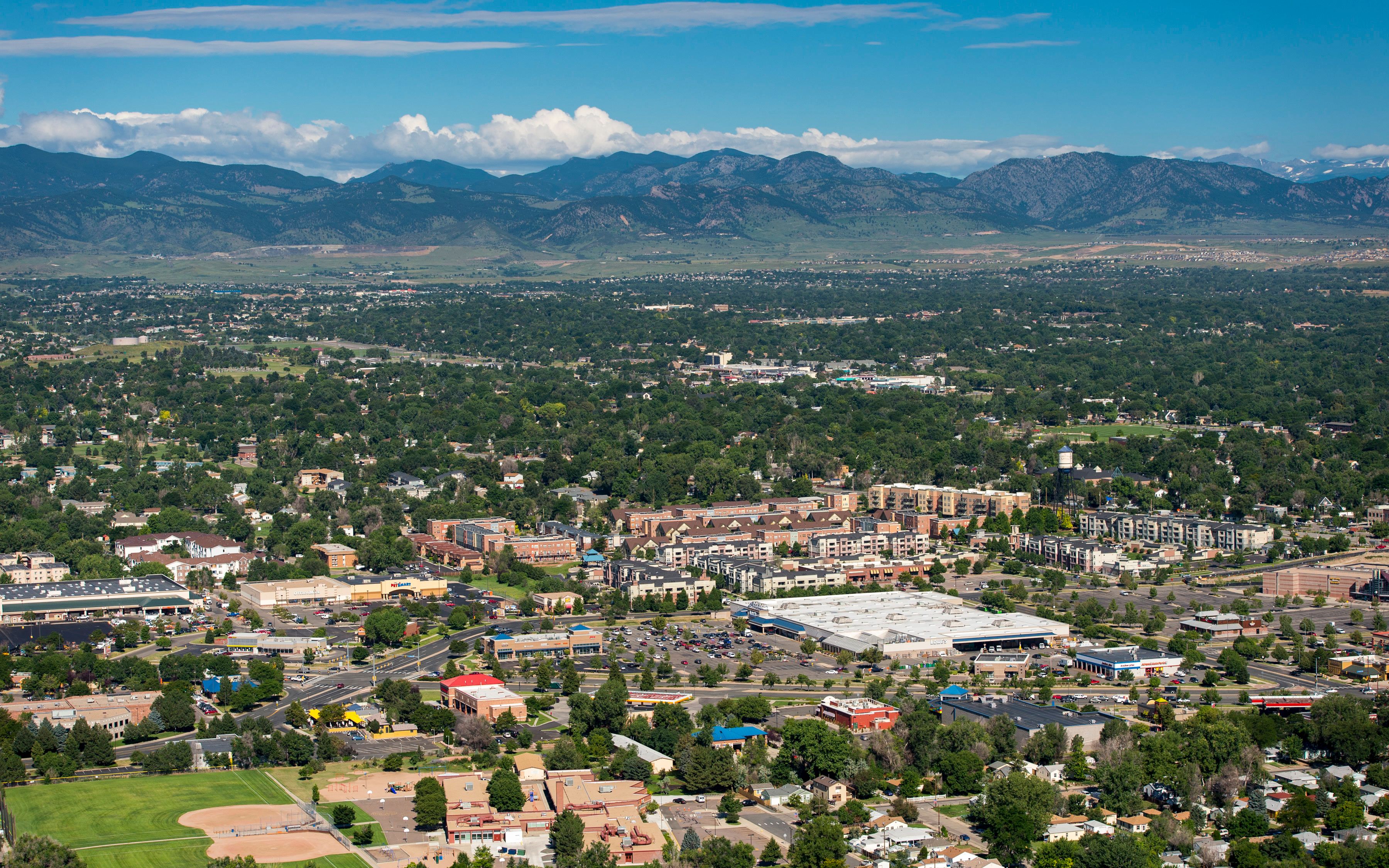 Arvada neighborhoods from above, with the foothills behind